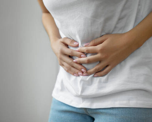 Hands holding uterus, female reproductive system